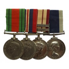 WW2 Defence Medal, War Medal, Naval General Service Medal (Clasps - Malaya, Near East) and RN LS&GC Medal Group of Four - Ldg. Tel. A.C.P. Davis, Royal Navy
