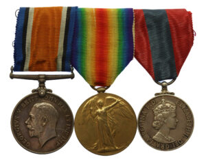 WW1 British War Medal, Victory Medal and Imperial Service Medal Group of Three - Pte. W.P. Davey, 10th Bn. East Kent Regiment - Wounded by Sergeant During Gun Demonstration