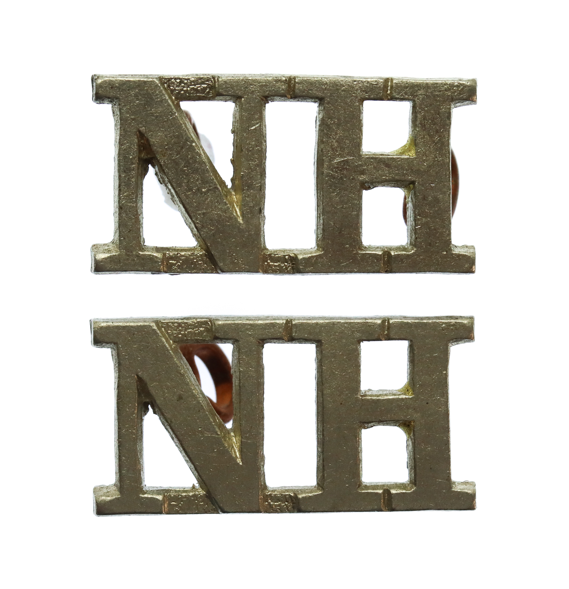 Pair of Northumberland Hussars (N.H.) Shoulder Titles