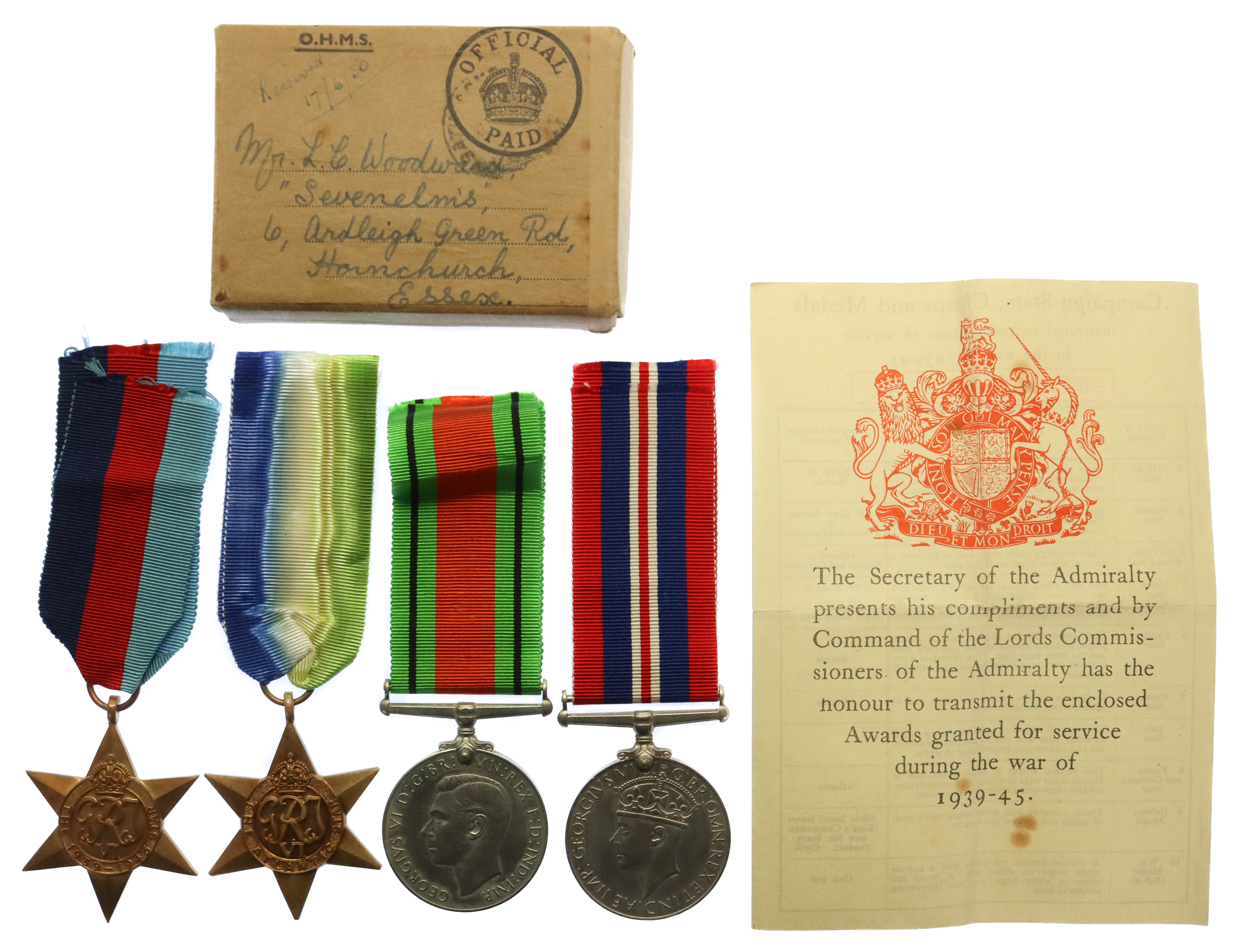 WW2 Medal Group of Four with Box of Issue & Entitlement Slip - Lieut. L.C. Woodward, Royal Navy (later RMVR)