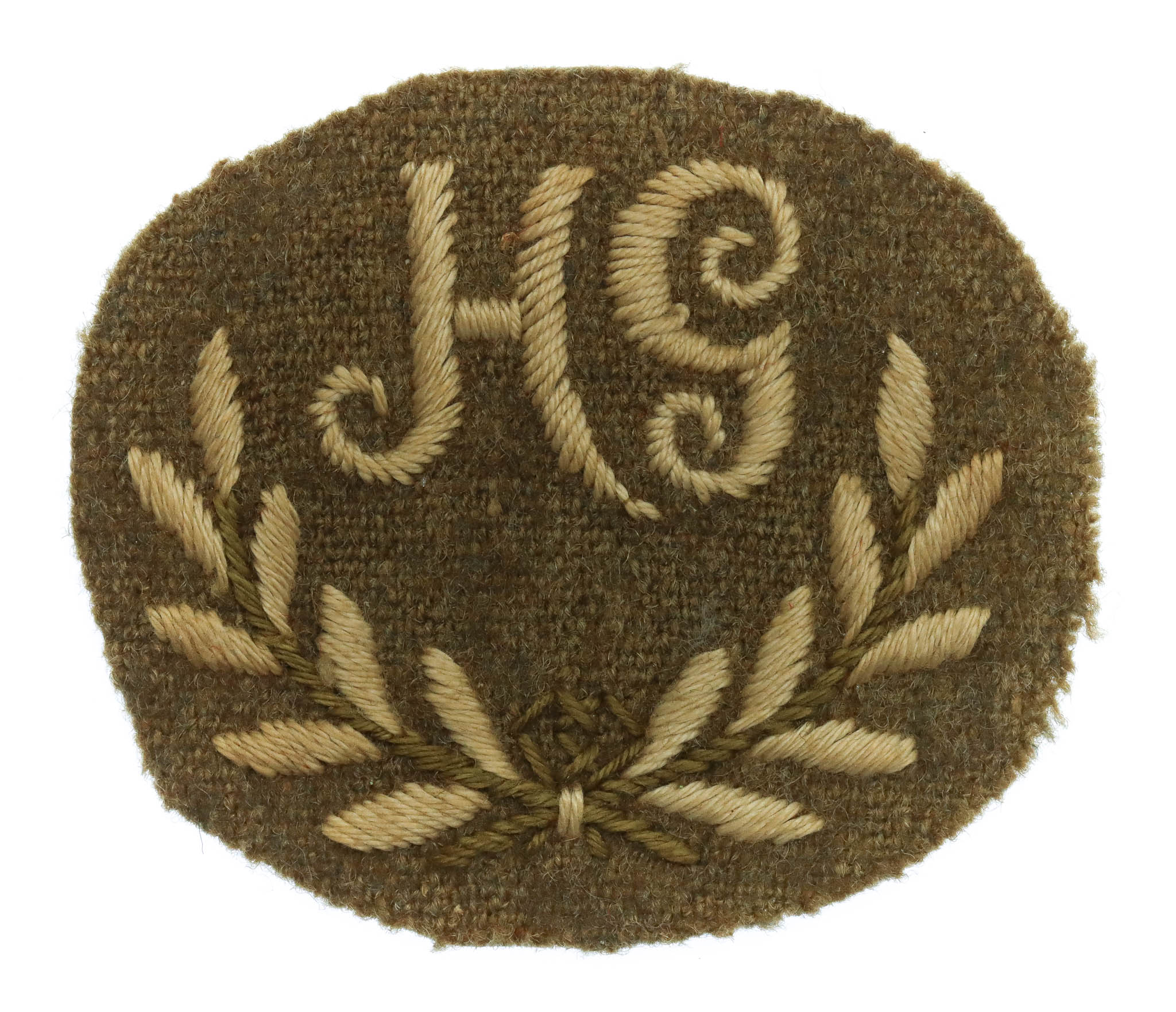 British Army Hotchkiss Gunner (H.G.) Cloth Proficiency Arm Badge
