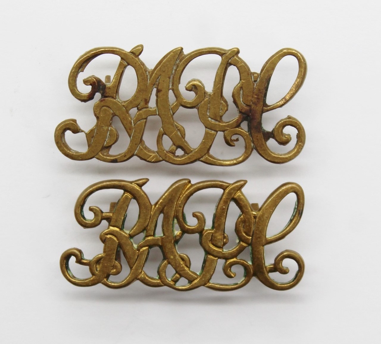 Pair of Royal Army Pay Corps (R.A.P.C.) Brass Shoulder Titles