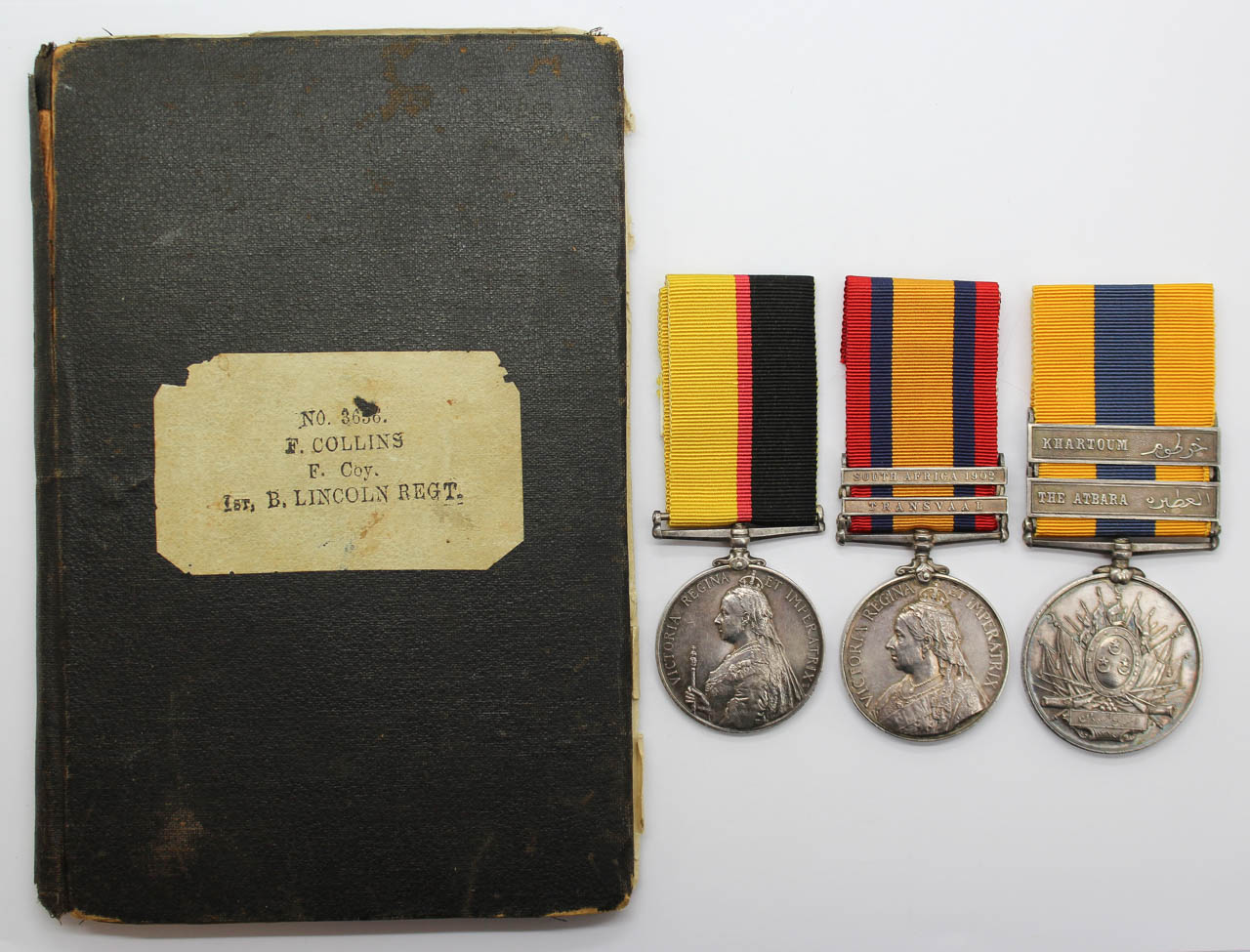 Queen's Sudan, Queen's South Africa (Clasps - Transvaal, South Africa 1902) and Khedives Sudan (Clasps - The Atbara, Khartoum) Medal Group of Three - Pte. F. Collins, Lincolnshire Regt