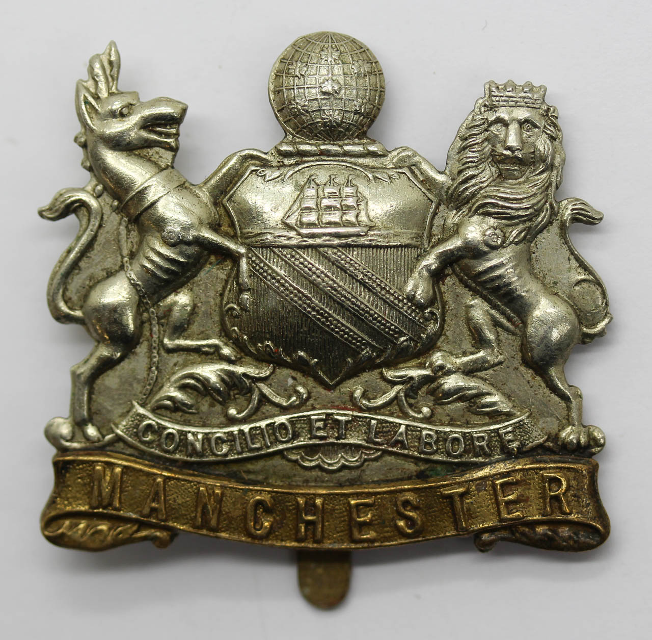 Manchester Regiment Non Voided Coat of Arms Cap Badge