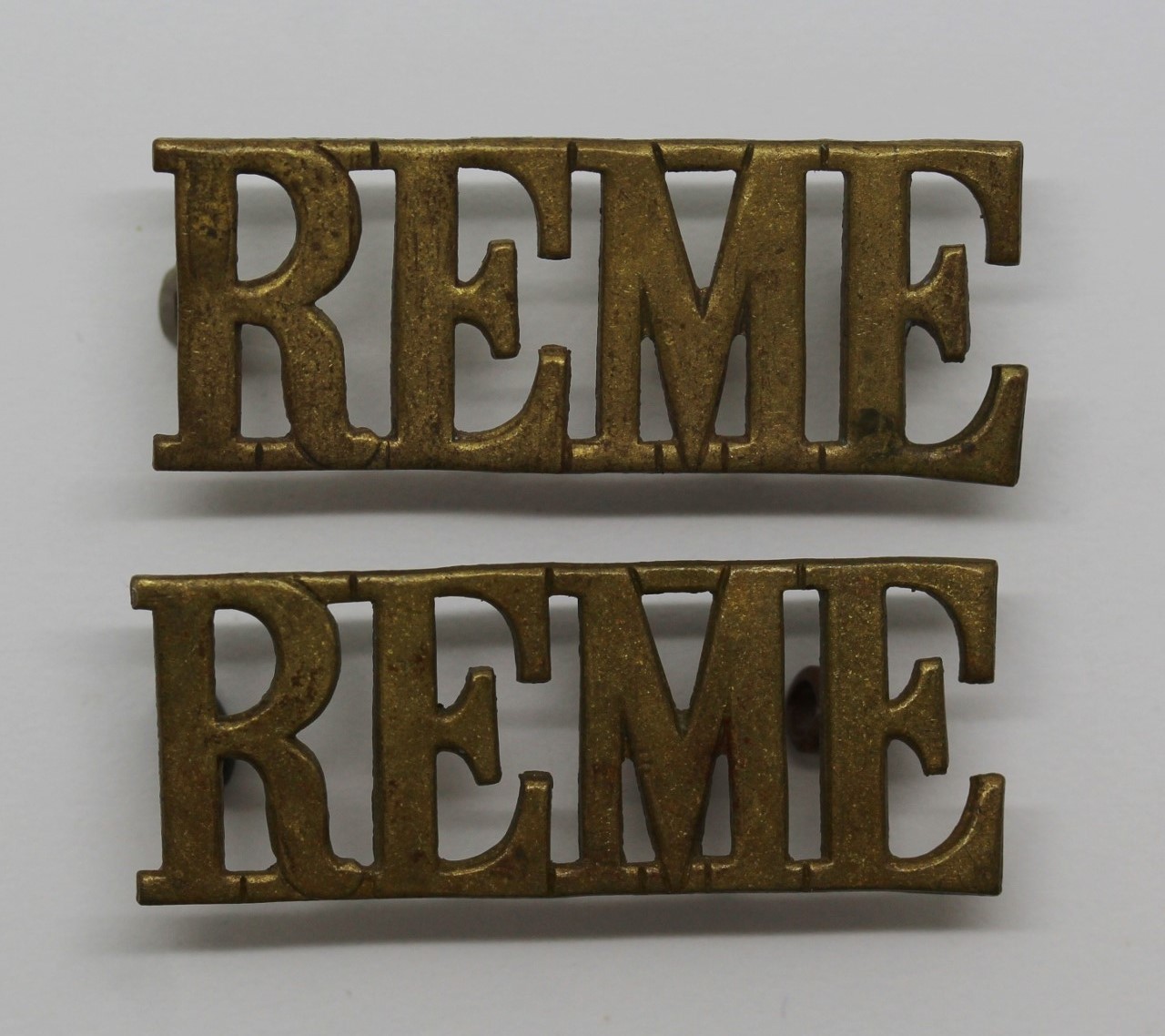 Pair of Royal Electrical & Mechanical Engineers (R.E.M.E.) Shoulder Titles