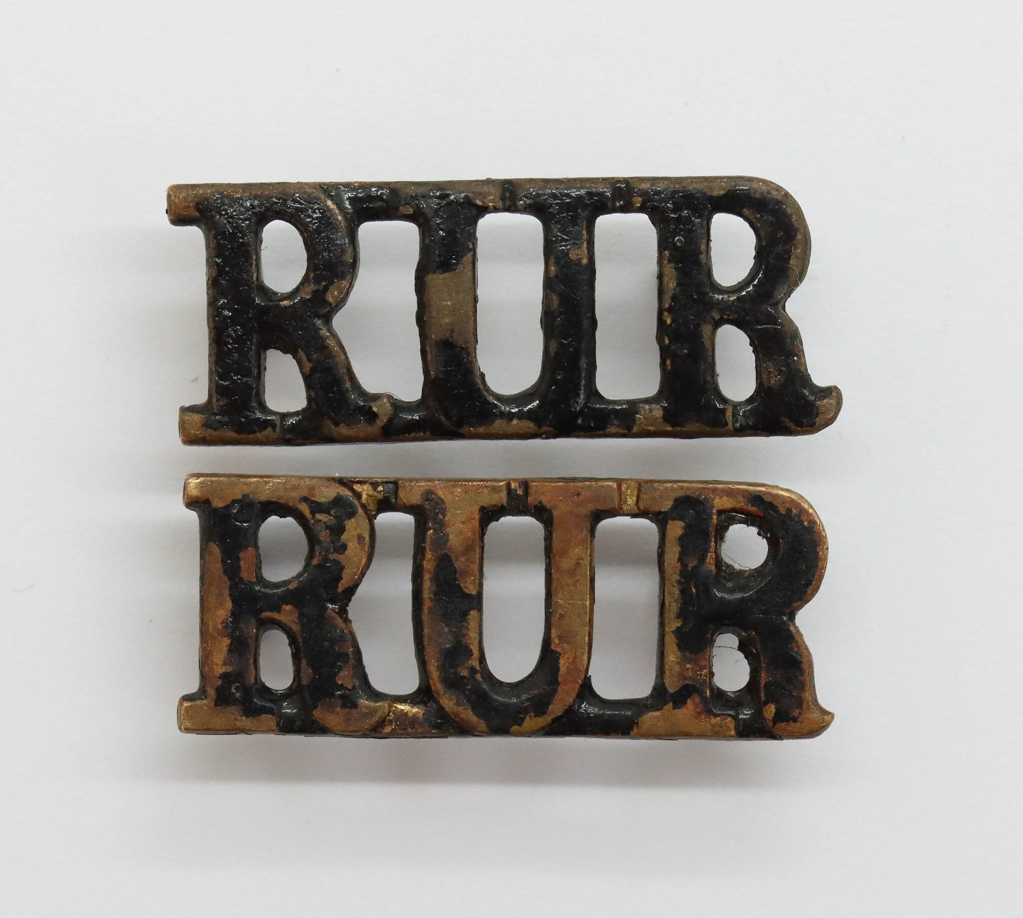 Pair of Royal Ulster Rifles (R.U.R.) Shoulder Titles