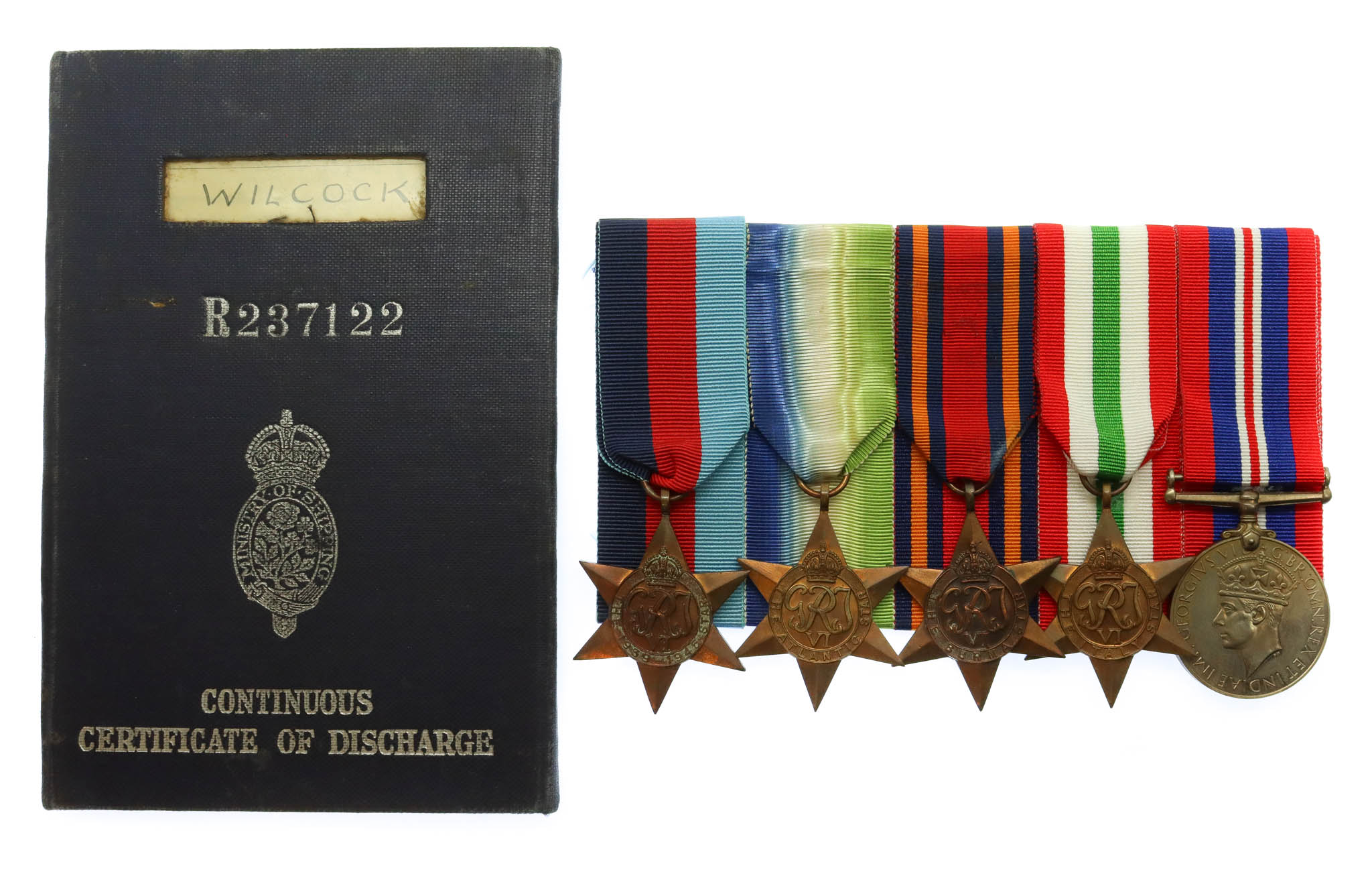 WW2 Merchant Navy Medal Group of Five with Certificate of Discharge Book - Radio Officer C.M. Wilcock, Merchant Navy
