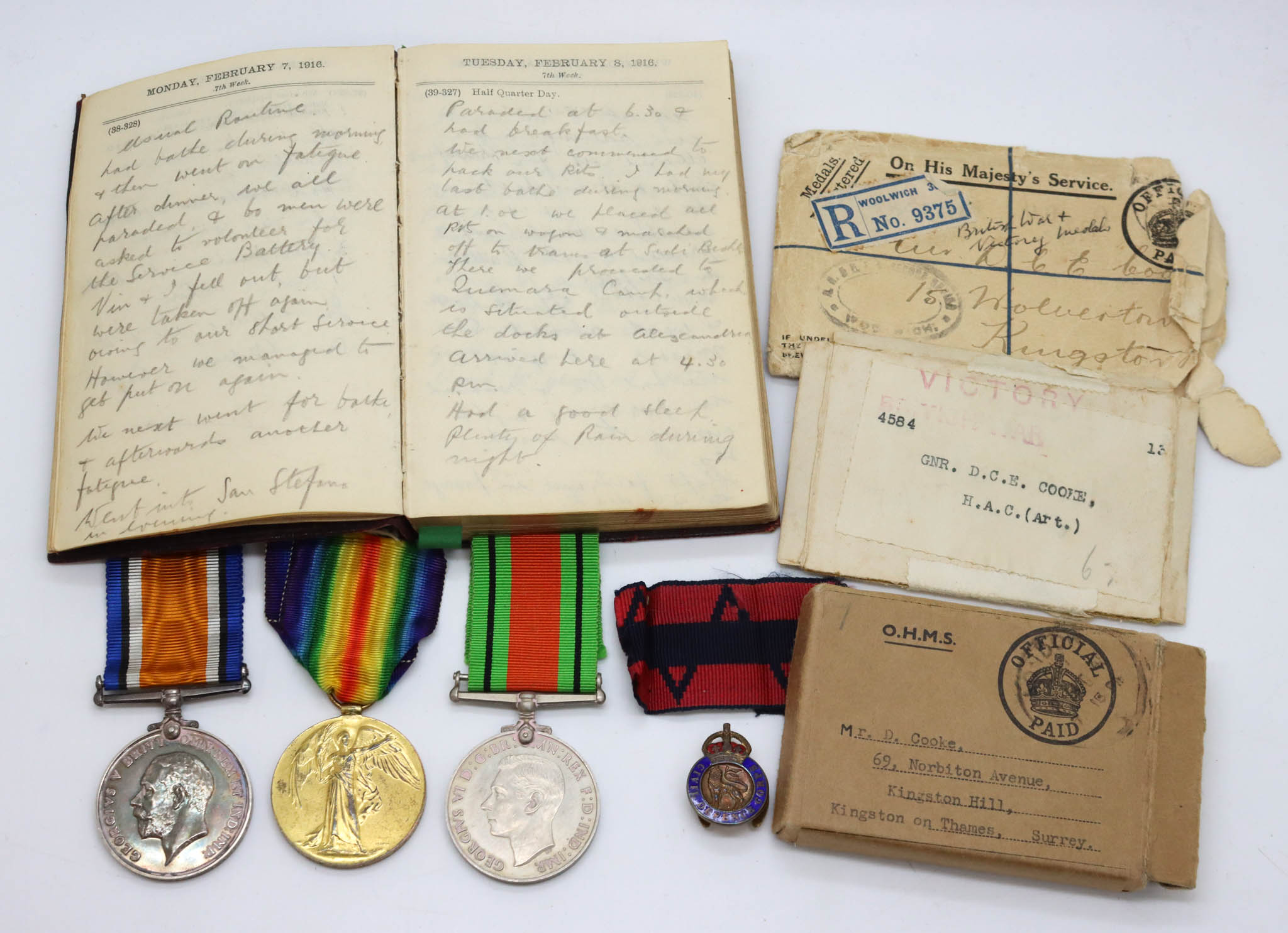 WW1 British War Medal, Victory Medal & WW2 Defence Medal Group with Diary and Boxes of Issue - Gnr. D.C.E. Cooke, 'A' Bty. H.A.C. (Artillery)