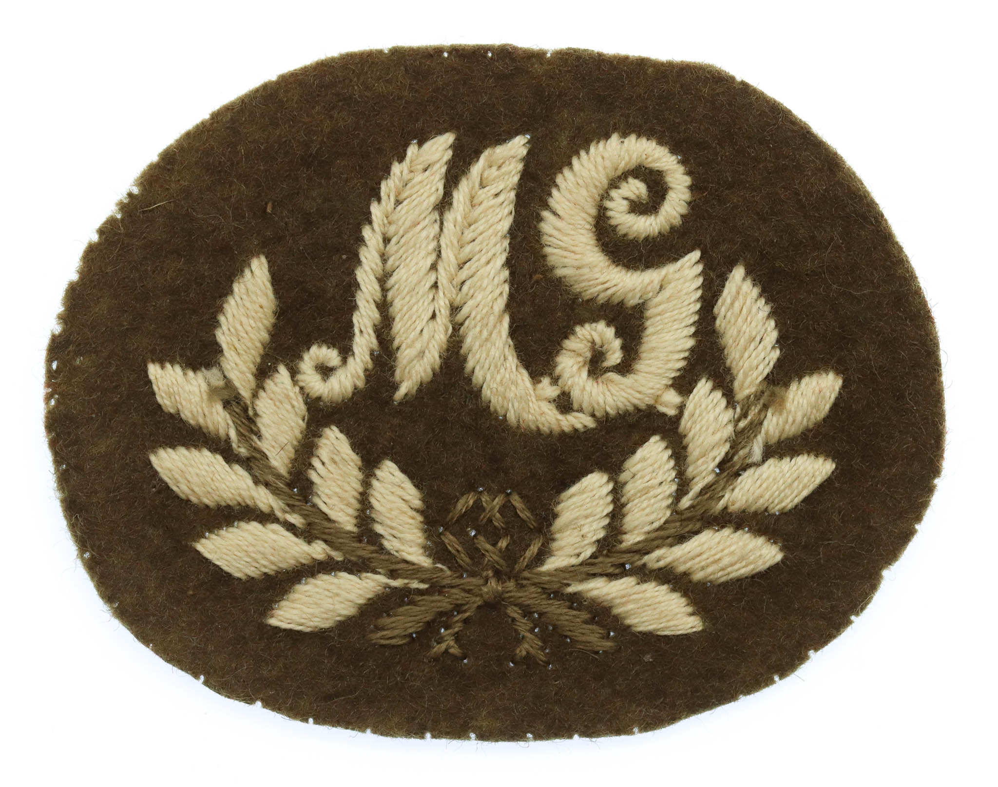 British Army Machine Gunner (M.G.) Cloth Proficiency Arm Badge