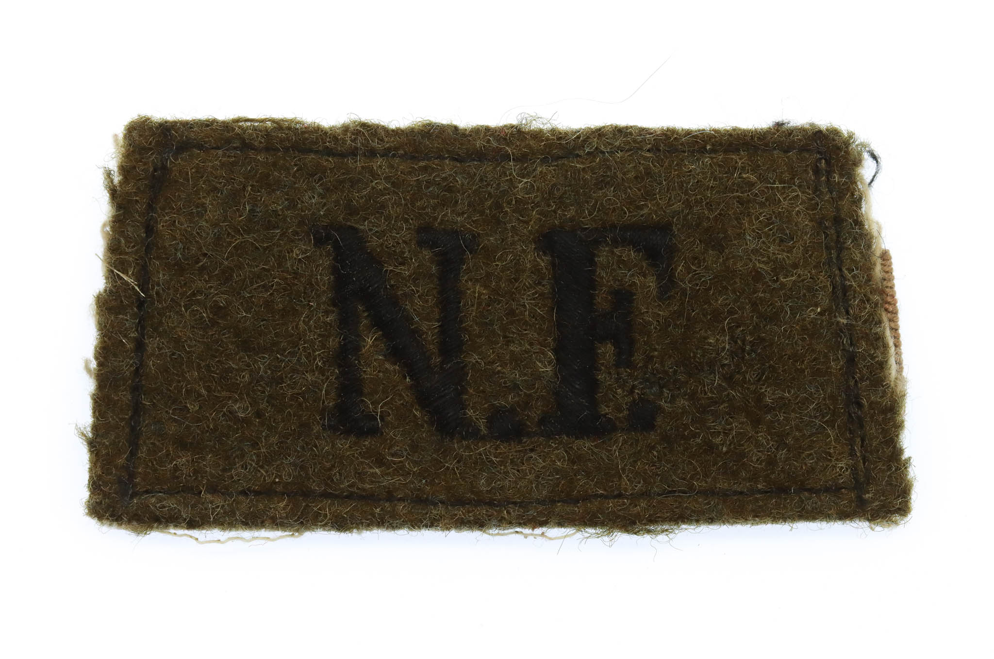 Northumberland Fusiliers (N.F.) WW2 Cloth Slip On Shoulder Title
