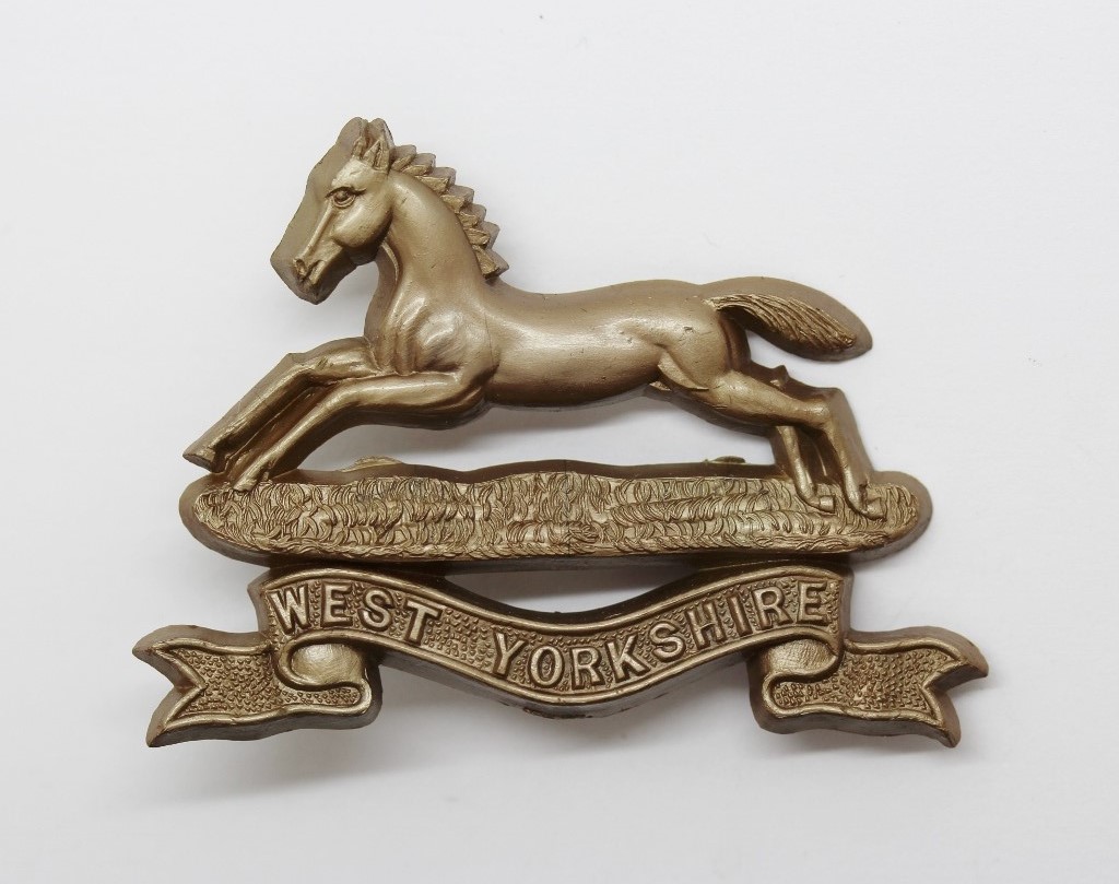 West Yorkshire Regiment WW2 Plastic Economy Cap Badge