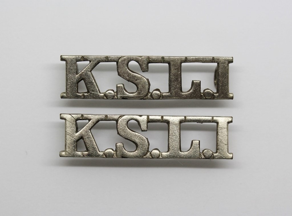 Pair of King's Shropshire Light Infantry (K.S.L.I.) White Metal Shoulder Titles