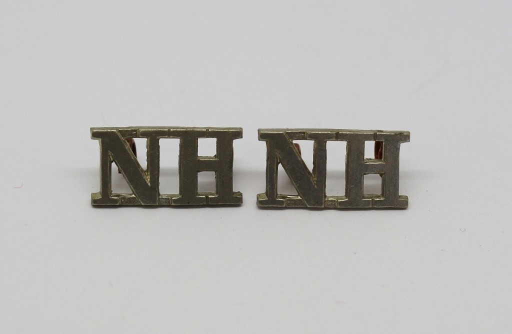Pair of Northumberland Hussars (N.H.) Shoulder Titles