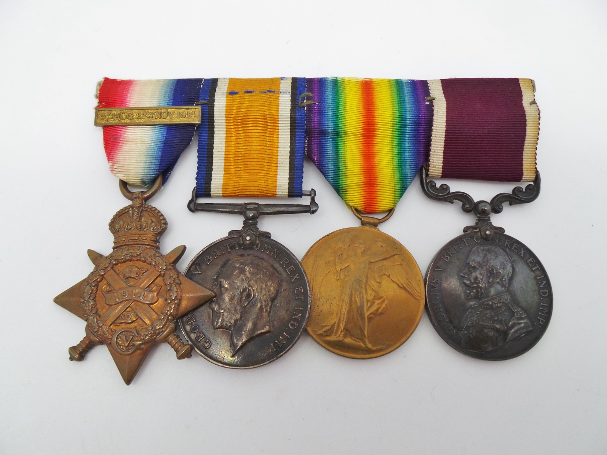 1914 Mons Star (with Slide on Bar) Medal Trio and Long Service & Good Conduct Medal Group - Cpl. W. Brooks, Royal Field Artillery