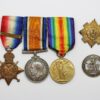 WW1 1914 Mons Star & Bar Medal Trio and Silver War Badge - Pte. G.E.S. Rogers, Scots Guards - Wounded
