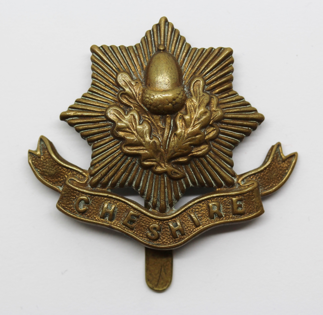 Cheshire Regiment WW1 All Brass Economy Cap Badge