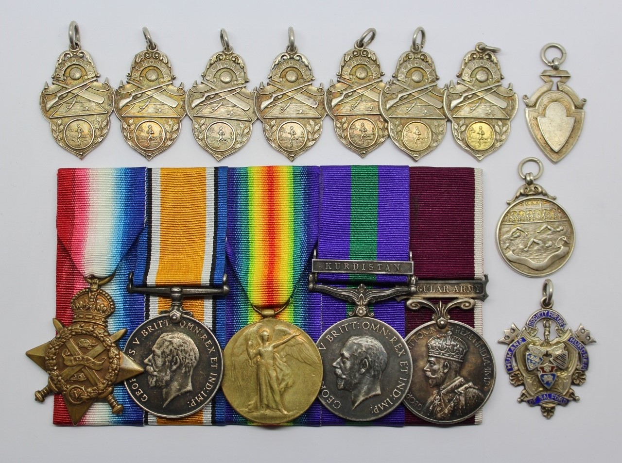 WW1 Prisoner of War 1914 Mons Star, British War Medal, Victory Medal, GSM (Kurdistan) and LS&GC Medal Group with Humane Society Swimming Proficiency Medal and 9 Other Silver Medals - Bandsman S. Inman, 2nd Bn. West Yorkshire Regiment