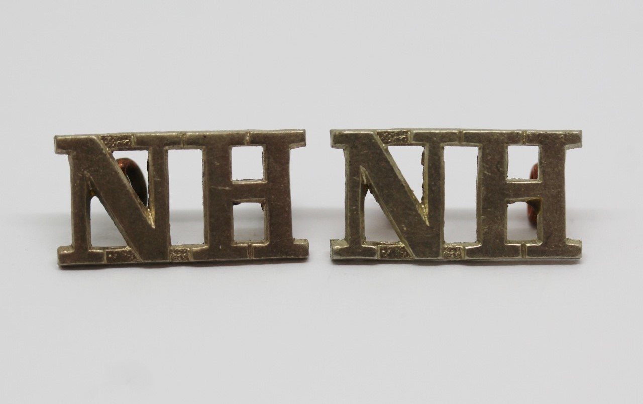 Pair of Northumberland Hussars (N.H.) Shoulder Titles