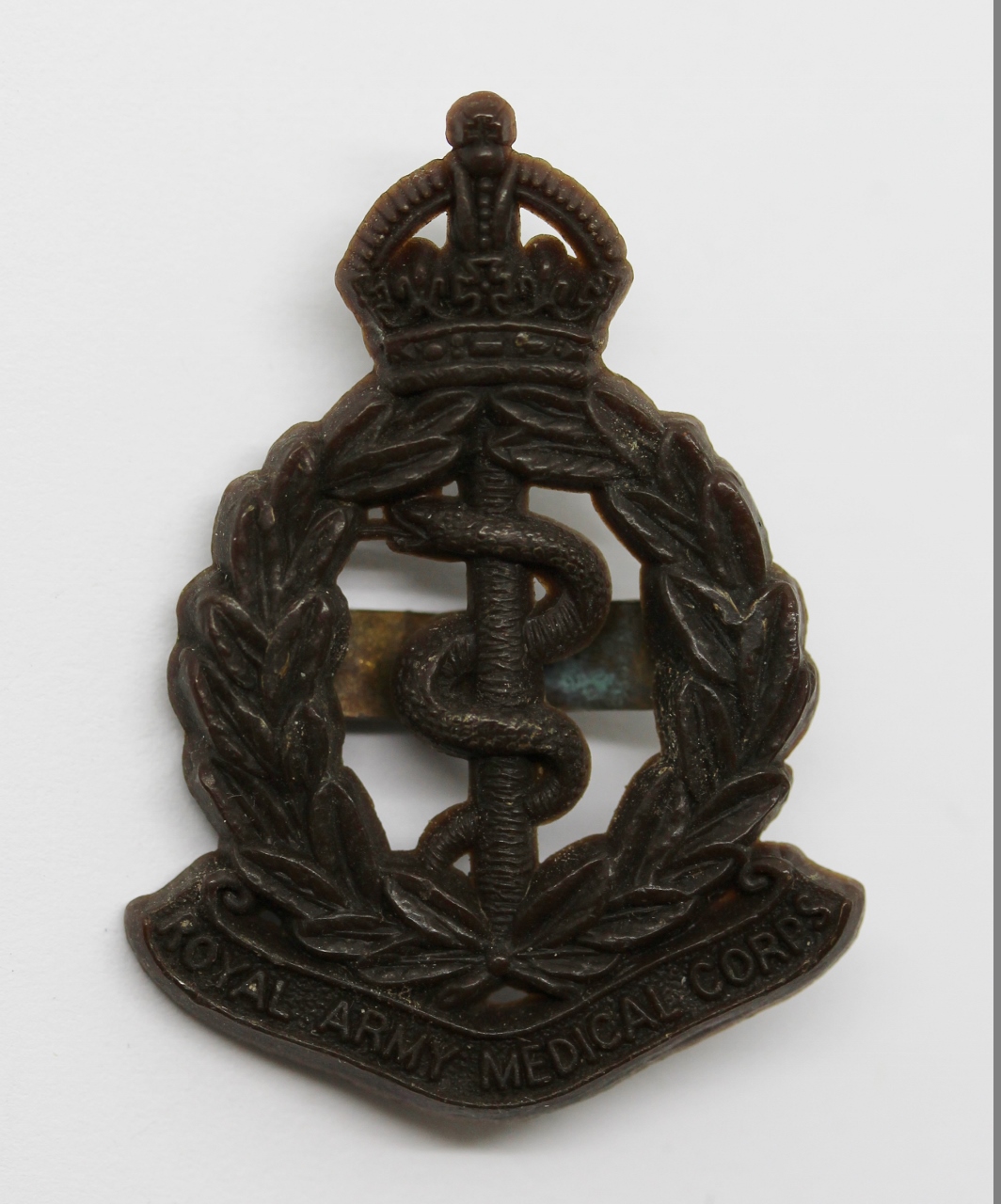 Royal Army Medical Corps (R.A.M.C.) WW2 Plastic Economy Cap Badge