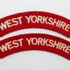 Pair of West Yorkshire Regiment Cloth Shoulder Titles