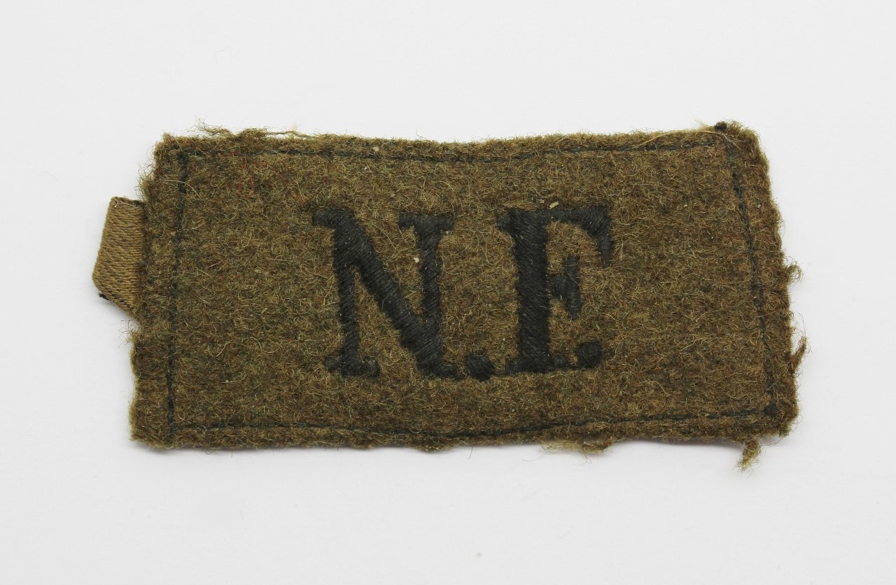 Northumberland Fusiliers (N.F.) Cloth Slip On Shoulder Title