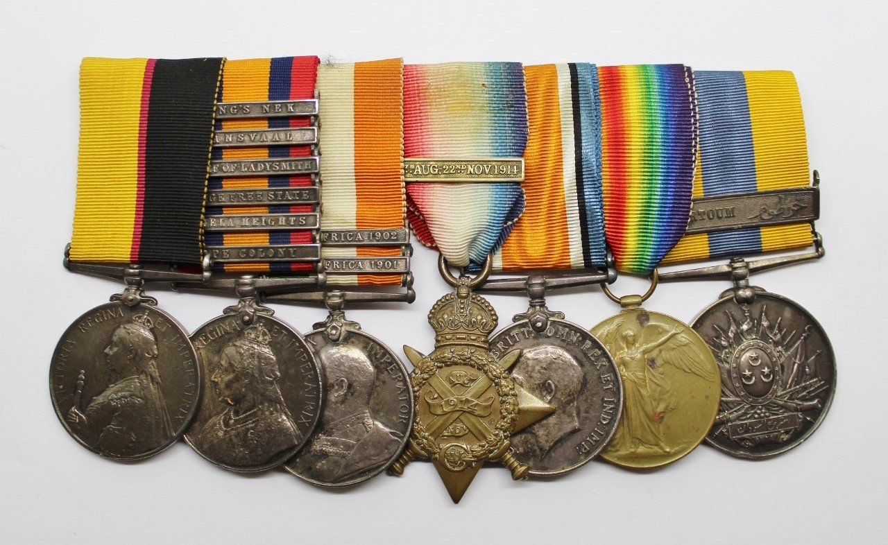 Queen's Sudan Medal, QSA (6 Clasps), KSA (2 Clasps), WW1 1914 Mons Star Trio and Khedives Sudan (Clasp - Khartoum) Medal Group of Seven - Dvr. R. Palmer, Royal Field Artillery